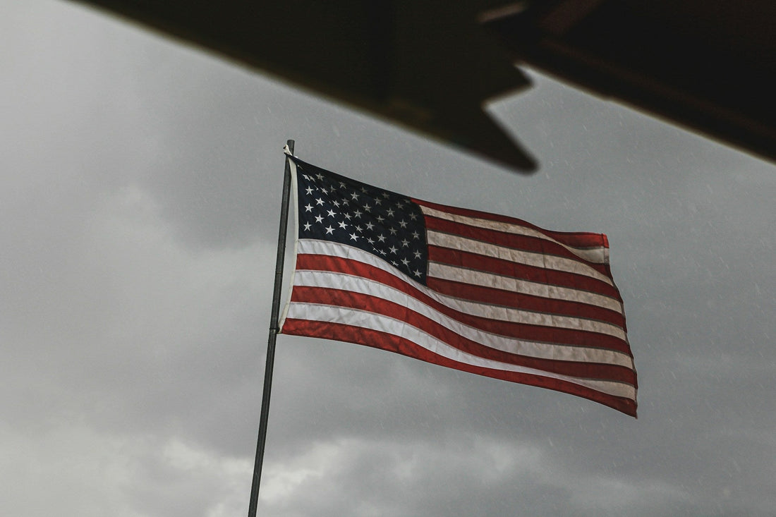 American flag exposed to rain and moisture on a flagpole
